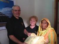 Distributing rice to the widows!