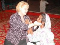Evangelist Donna ministering to woman Pakistan