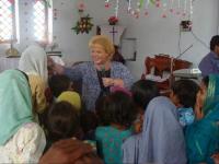 Donna teaching and ministering at the Children's service in Pakistan